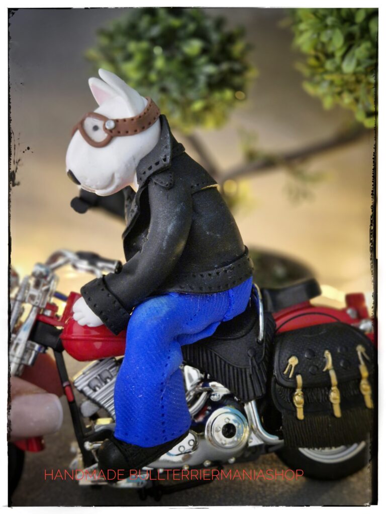 Handmade Biker Bull Terrier Sculpture riding a classic red motorcycle