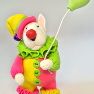 Colorful handmade Bull Terrier clown figurine with a heart balloon. Unique polymer clay collectible gift for Bull Terrier lovers and dog enthusiasts.