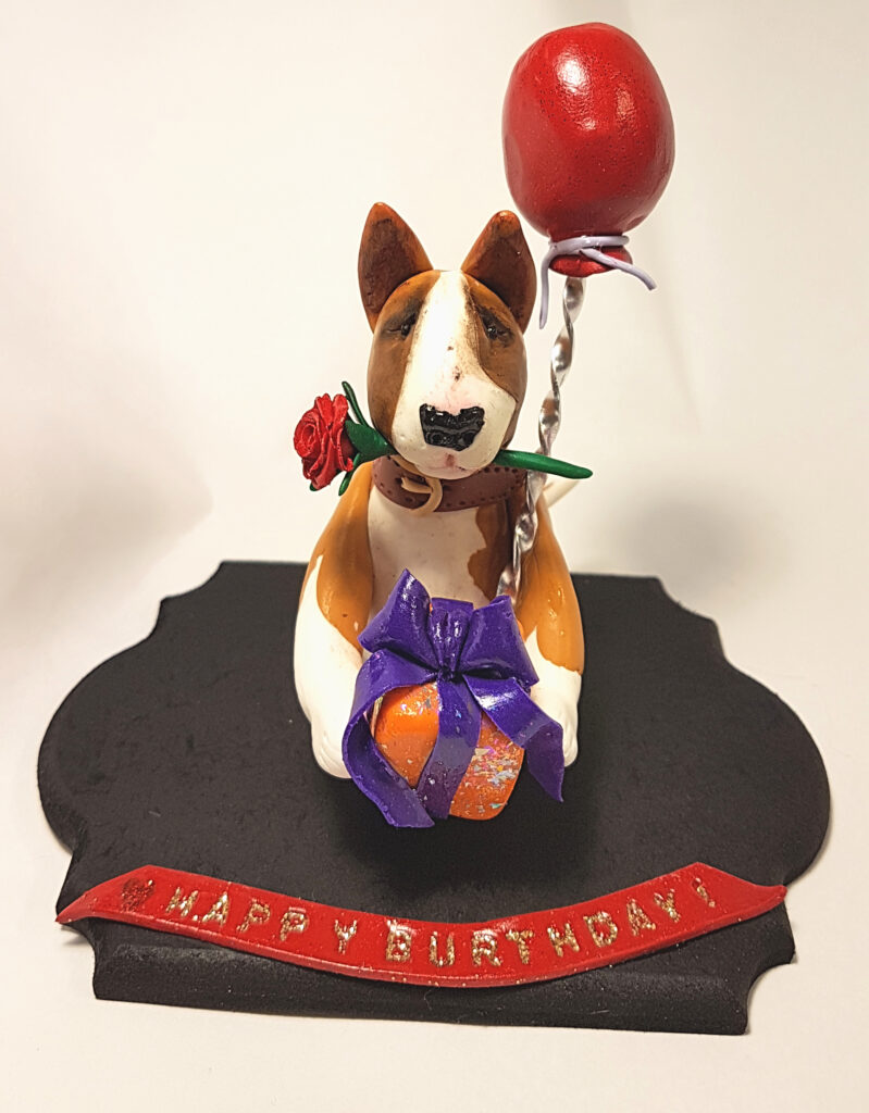 Handmade Bull Terrier birthday figurine with balloon, gift box and personalized birthday message