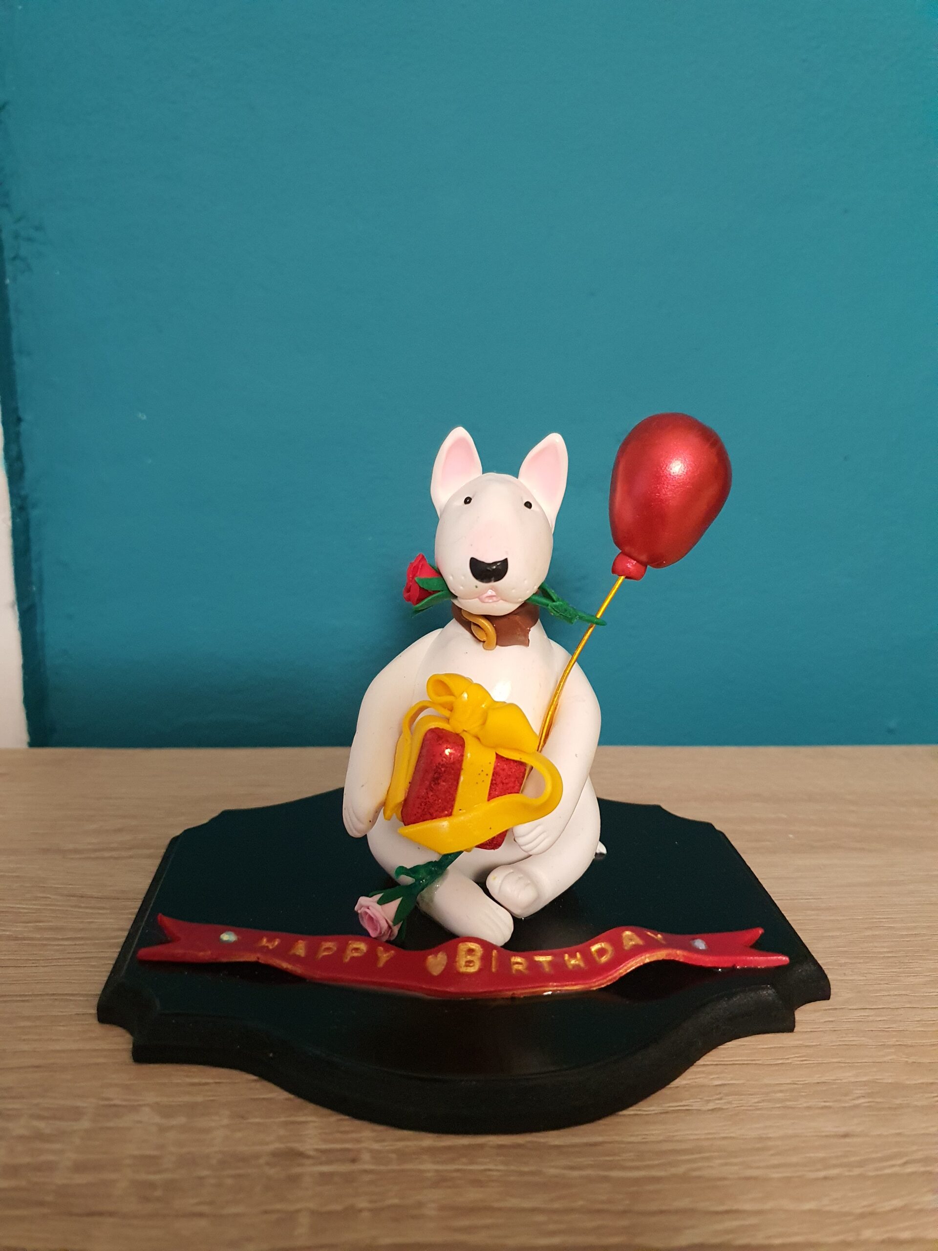 Handmade Bull Terrier birthday figurine with balloon, gift box and personalized birthday message