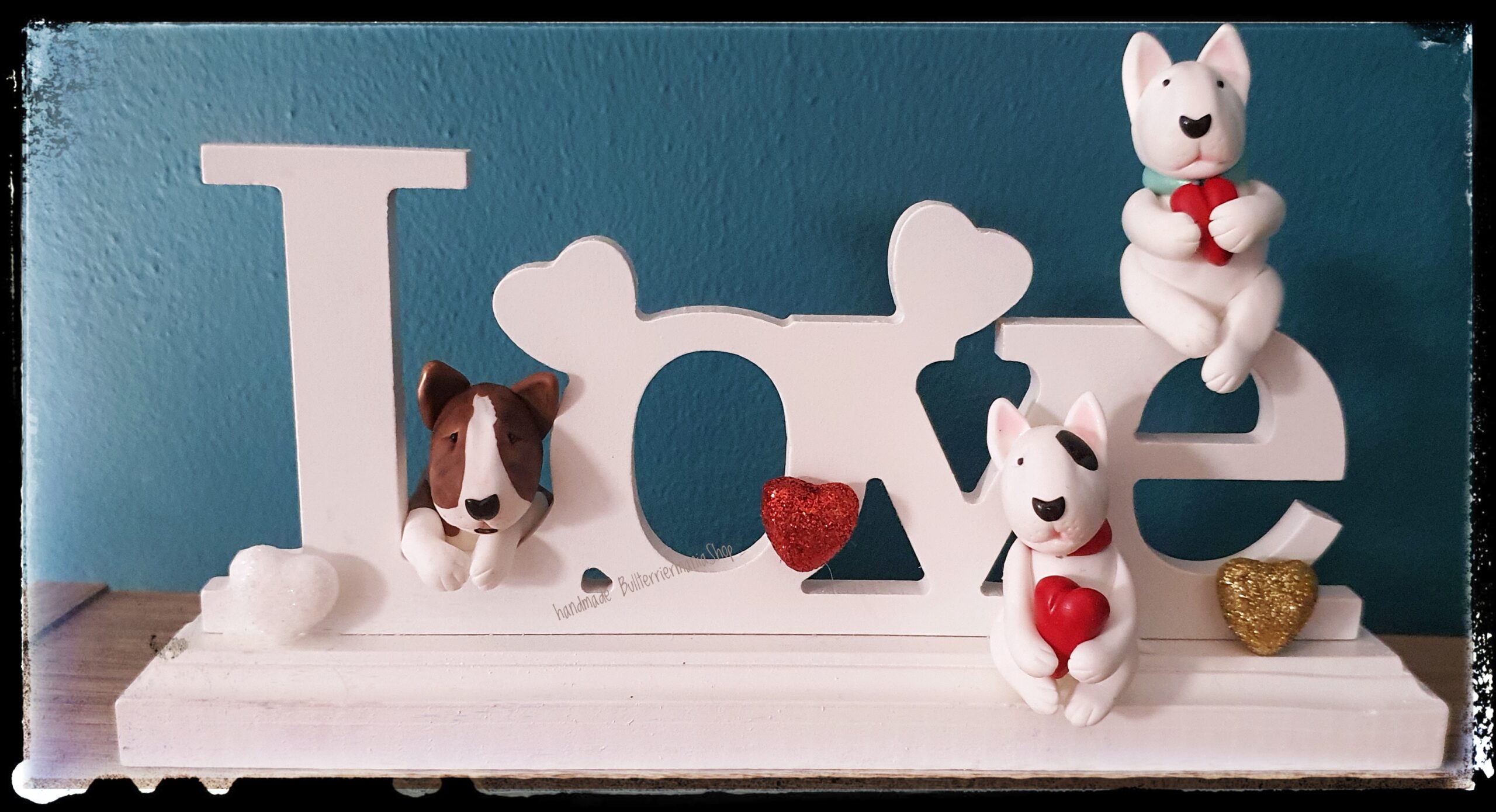 Handmade Bull Terrier Love sign with three Bull Terrier figures holding red hearts