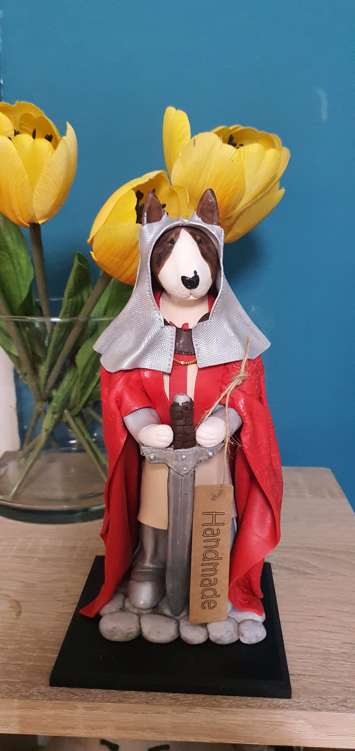 Bull Terrier figurine wearing medieval armor and red cape
