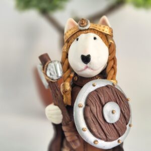 Female Viking Bull Terrier figurine holding an axe and shield