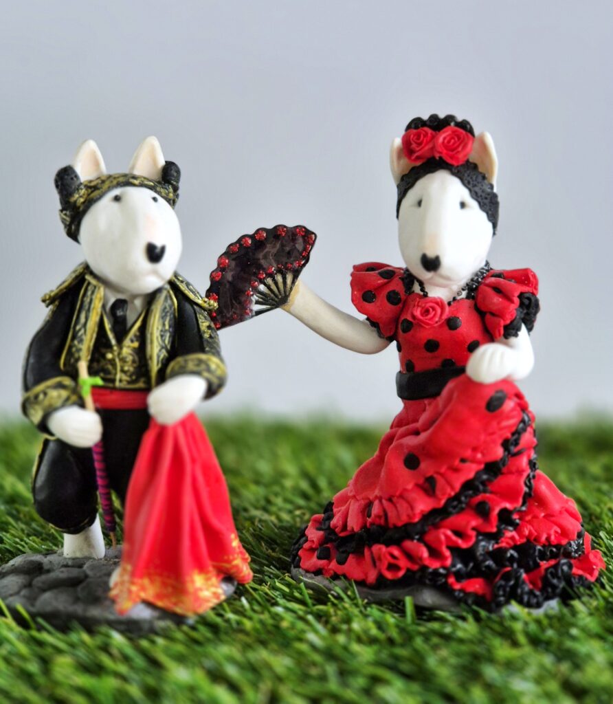Spanish Bull Terrier couple handmade figurines featuring a matador and flamenco dancer.