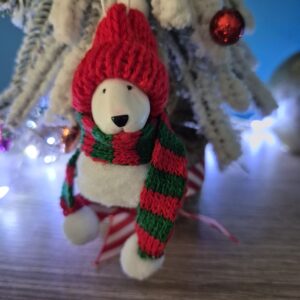 Bull Terrier Pom Pom Christmas ornament hanging on snowy Christmas tree