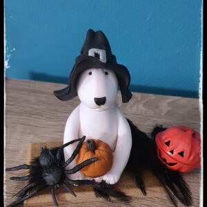 White Bull Terrier Halloween figurine with witch hat and pumpkin