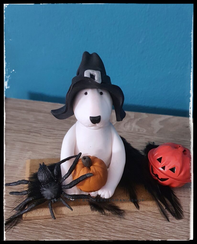 White Bull Terrier Halloween figurine with witch hat and pumpkin
